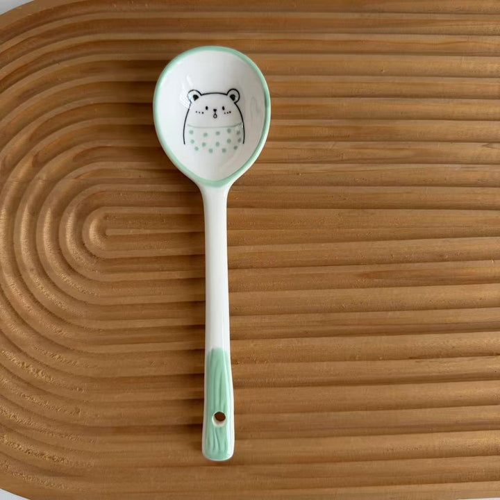 Ceramic soup spoon with lucky cat illustration and ergonomic long-handle Bowlift