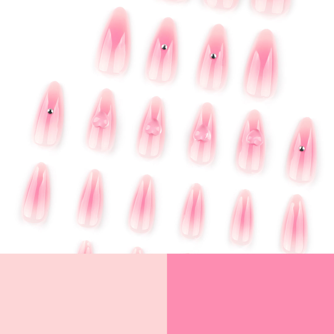 Artful stiletto nails with heart design and glitter accents Bowlift
