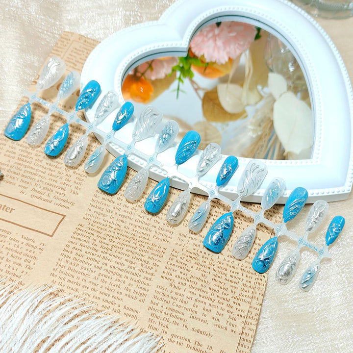 Creative artificial nails with shiny silver and turquoise tones Bowlift