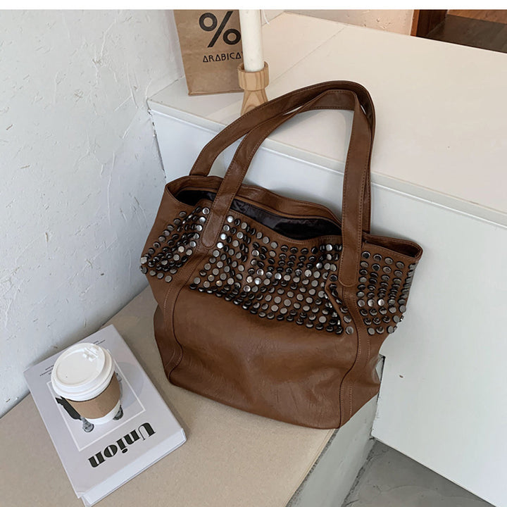 Fashionable shoulder bag with stylish rivet details Bowlift