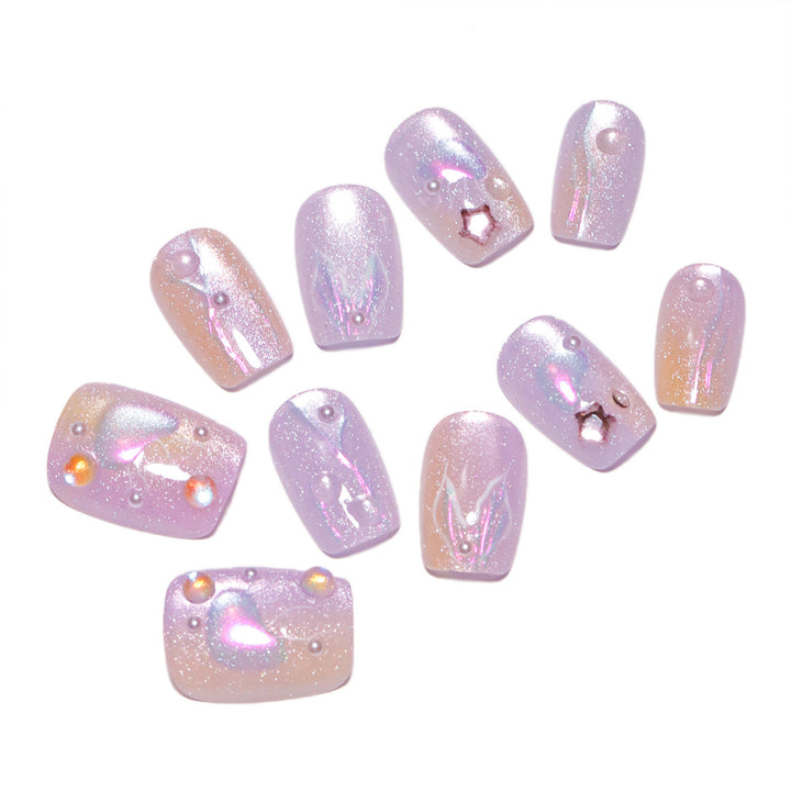 Artificial nail art with sparkling accents and transparent color gradient Bowlift