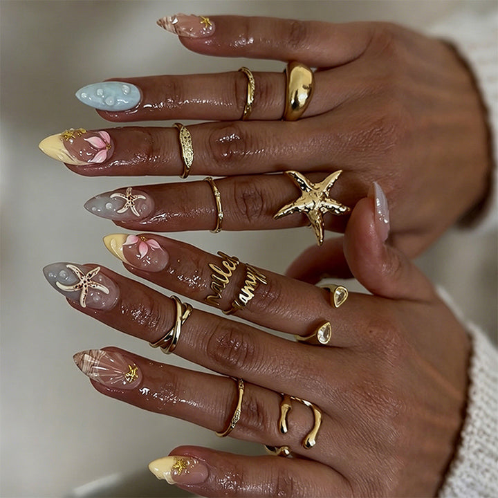 Artificial nail set with floral motifs and glitter accents Bowlift