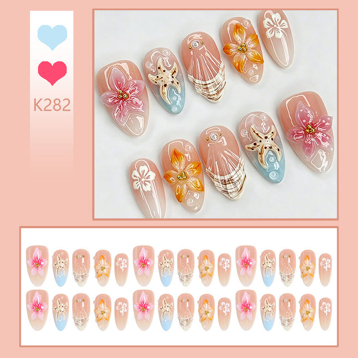 Artificial nail set with filigree flower and glitter details Bowlift