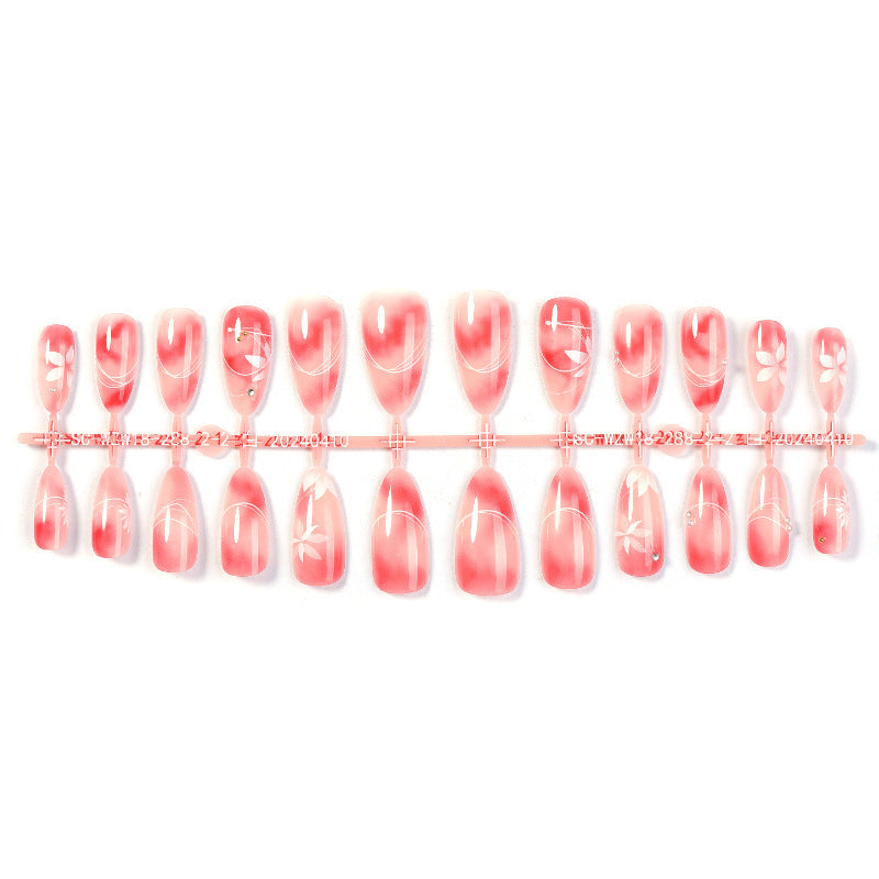 Acrylic nail set with elegant ombre design and floral accent Bowlift