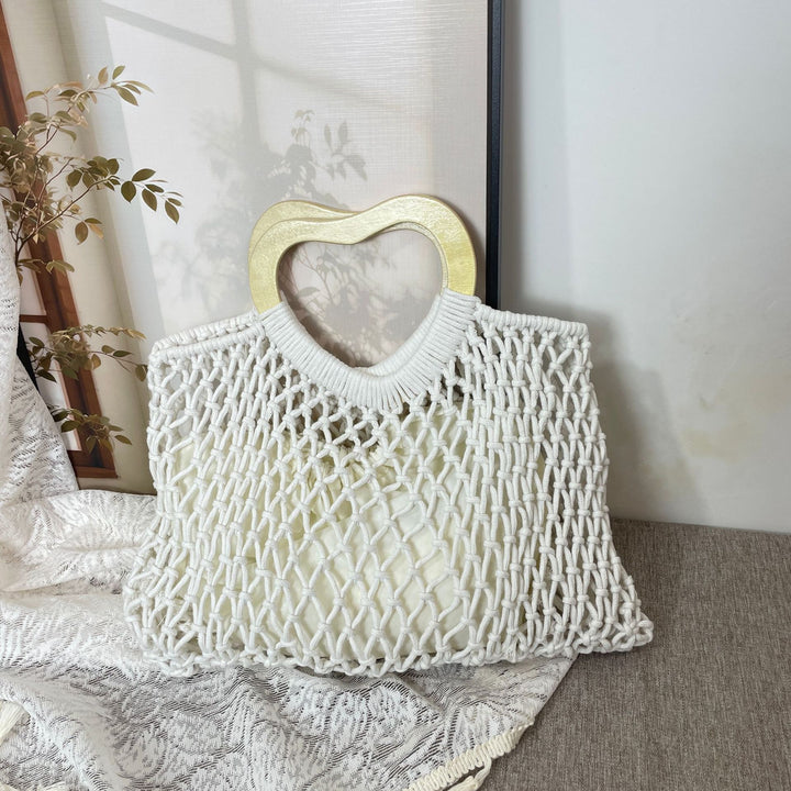 Stylish handbag with heart-shaped handle Bowlift