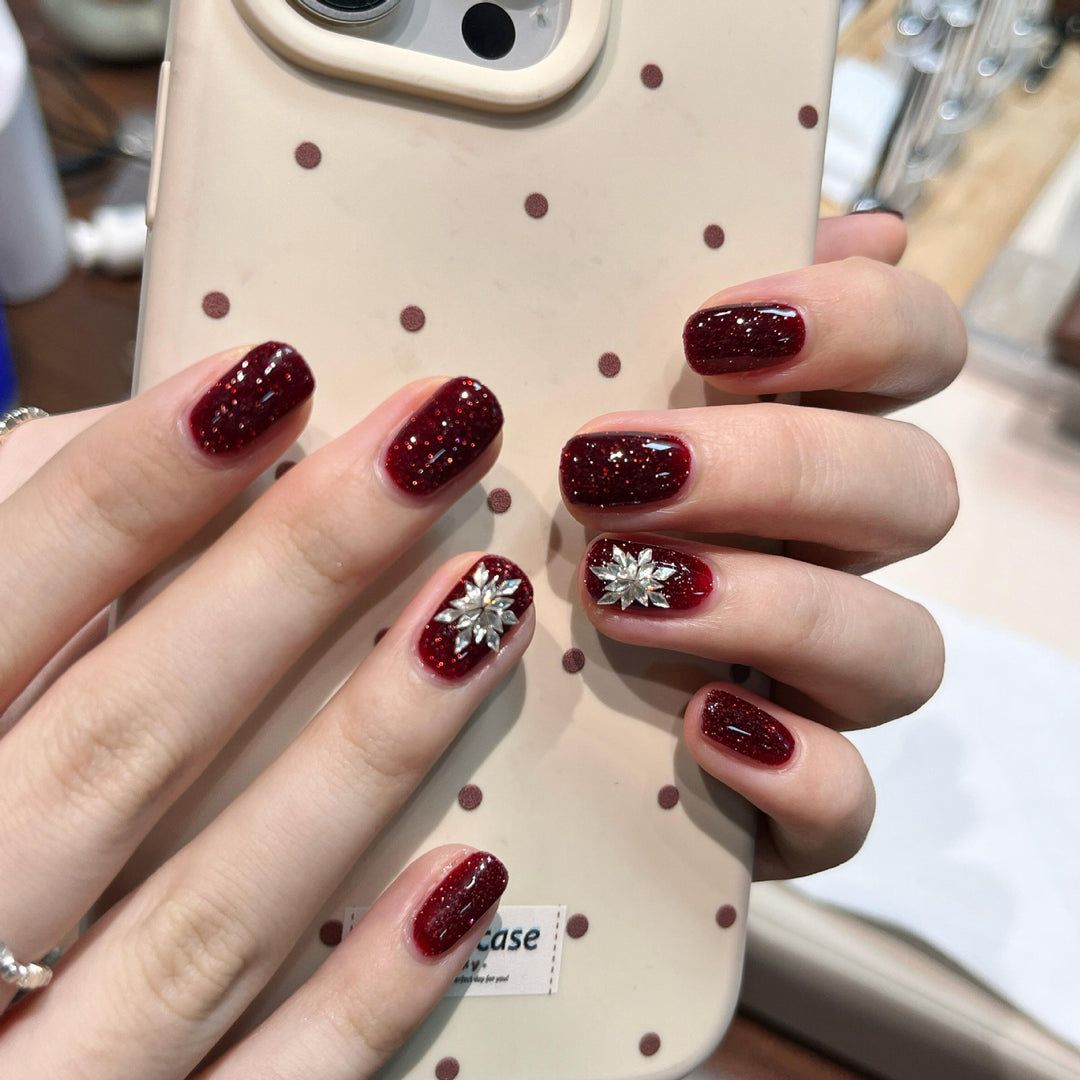 Glamorous artificial nails with rhinestone applications Bowlift