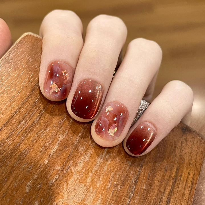 Artificial nails with elegant gradient and golden accents Bowlift