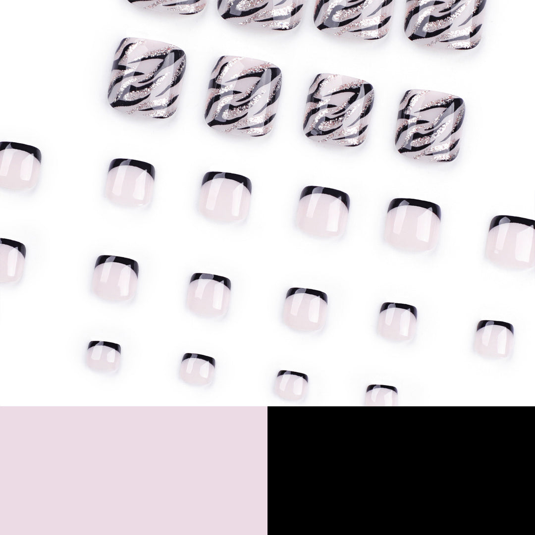 Artificial toenail art in elegant black and white design Bowlift