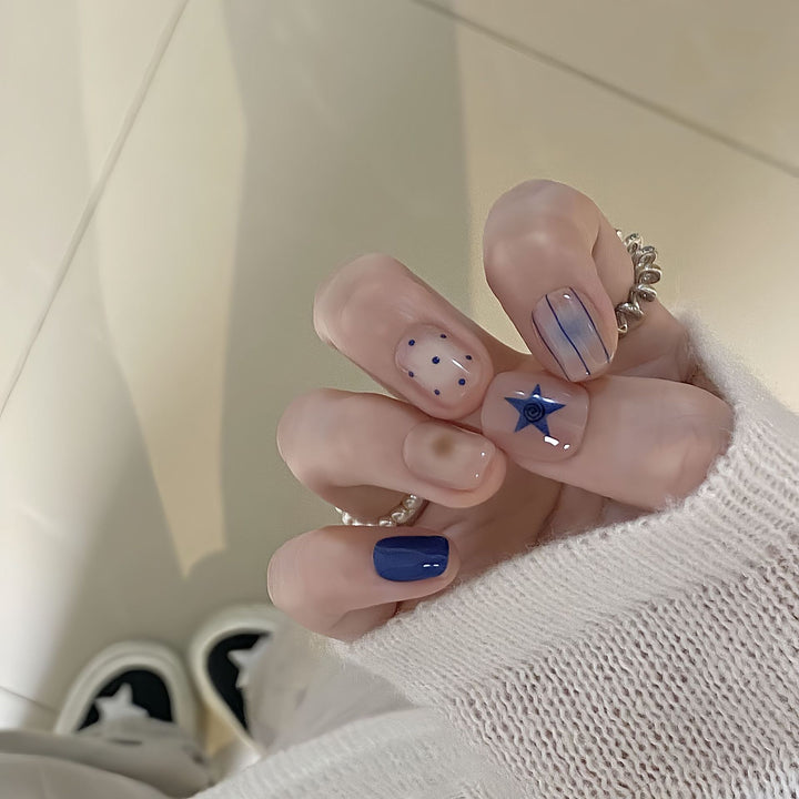 Artificial nails in modern design with geometric and sparkling accents Bowlift