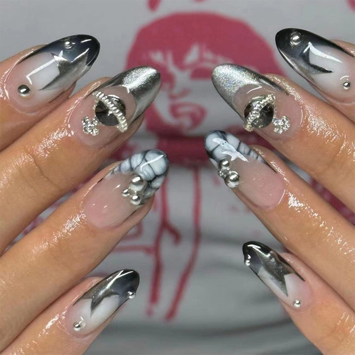 Artful acrylic nails with elegant 3D decorations and glitter effects Bowlift