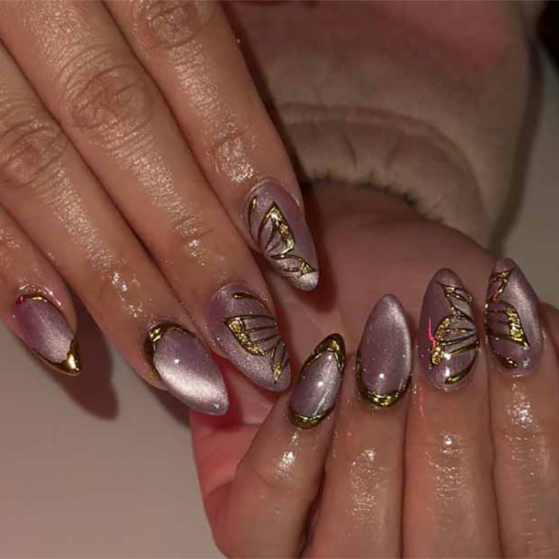 Artful Nail Extensions with Golden Accents Bowlift