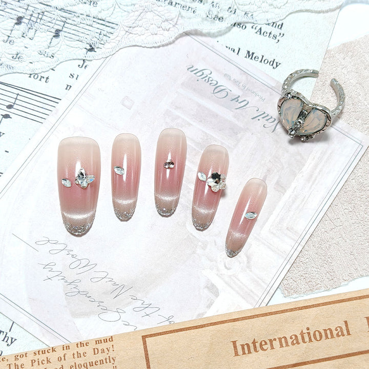 Glamorous artificial nails with rhinestone decorations Bowlift