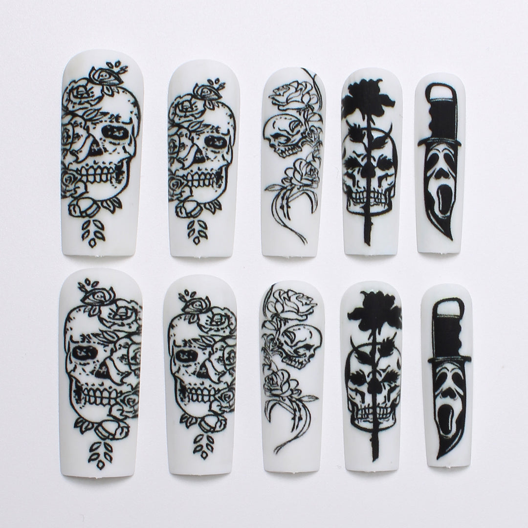 Nail set with spooky skull design and floral motifs Bowlift
