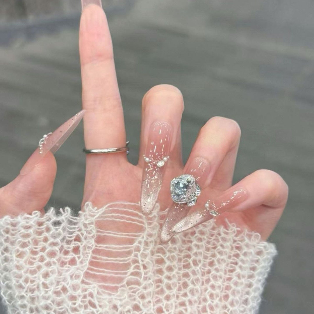 Artistic Stiletto Press-On Nail Art with Glimmering Accents Bowlift