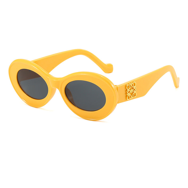 Women's fashionable sunglasses with oval frame and golden applications Bowlift