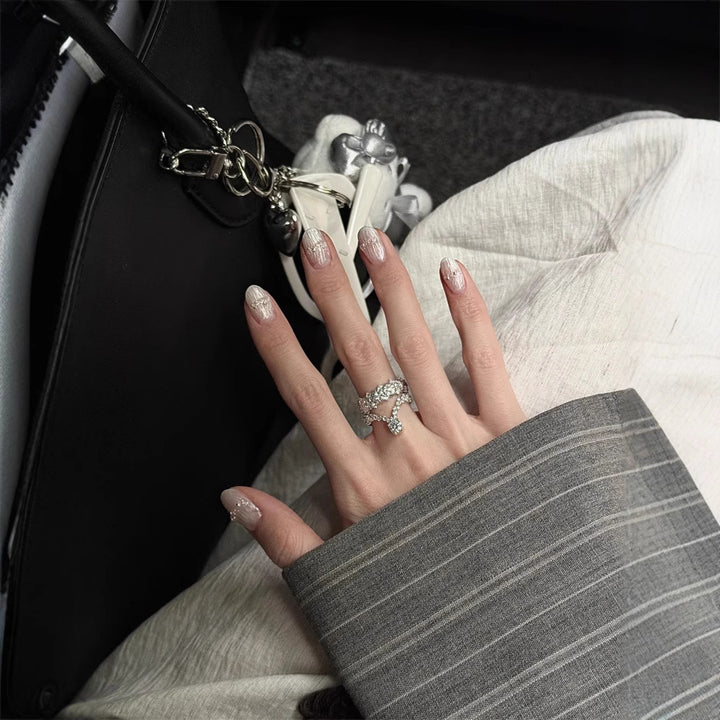 Artificial nails with decorative accents Bowlift