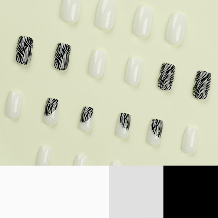 Artful nail extensions with stylish zebra pattern Bowlift