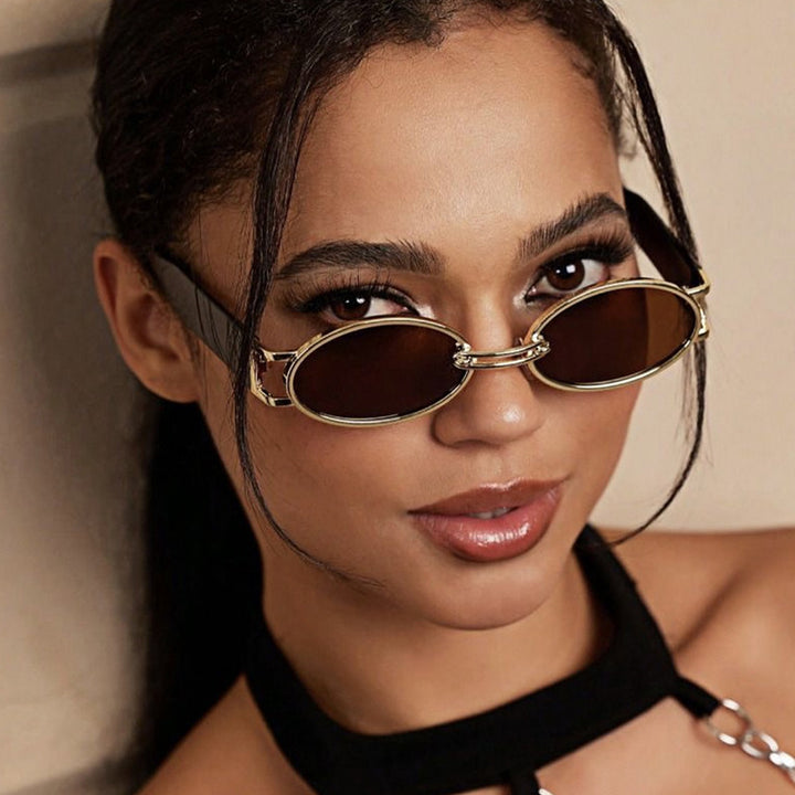 Women oval-shaped sunglasses with golden accents and stylish frame Bowlift