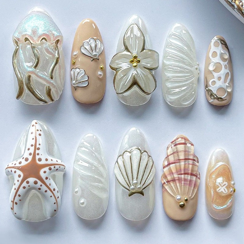 luxurious artificial nail set with maritime designs and golden accents Bowlift