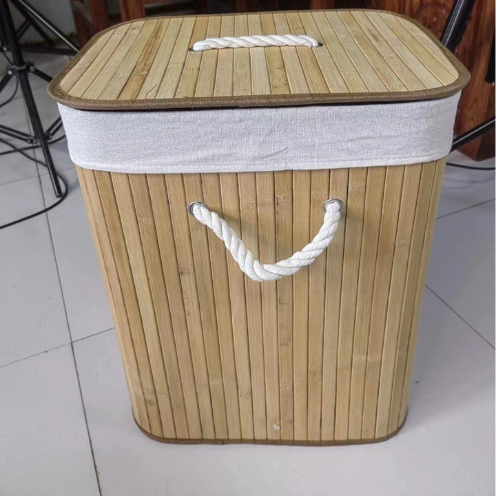 Laundry basket made of natural bamboo by Bowlift