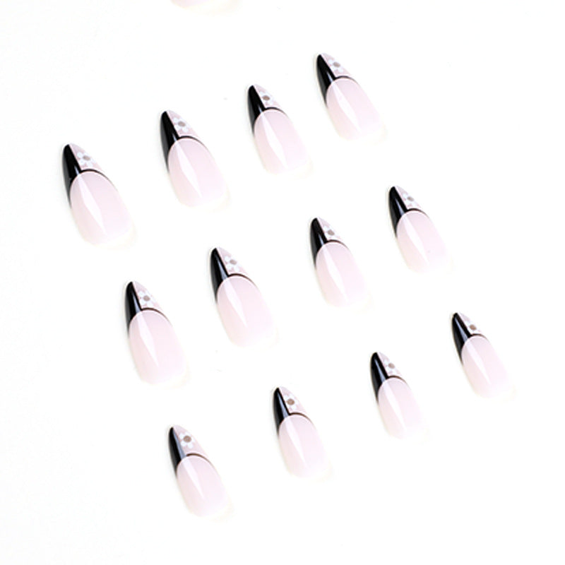 Artful nail art with elegant black-and-white design and floral accents Bowlift