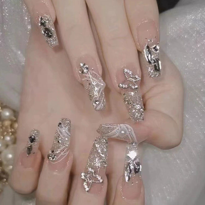 Elegant nail design with pearl embellishment Bowlift