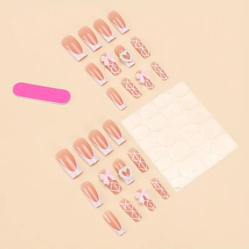 Elegant artificial nail tips with heart and bow accents Bowlift