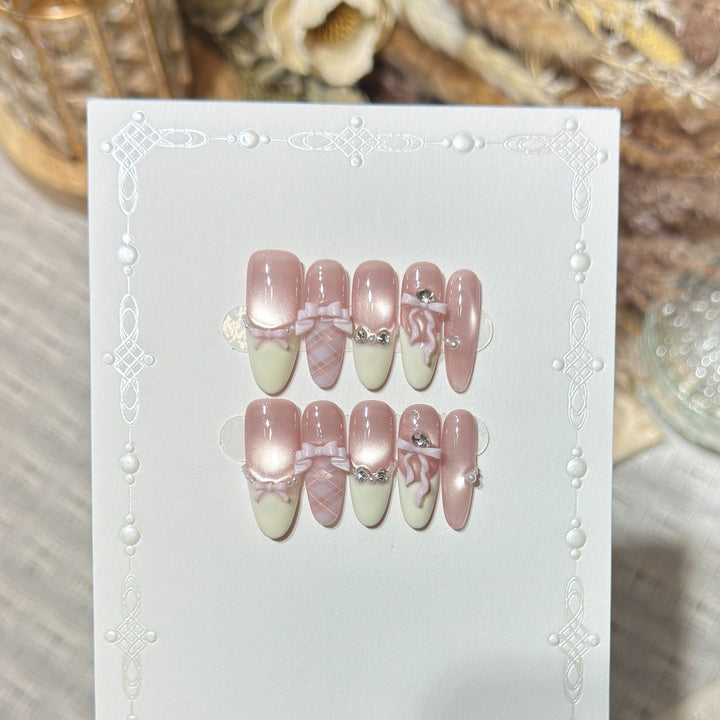 Elegant Stiletto Press-On Nail Set with Decorative Bow and Gem Accents Bowlift