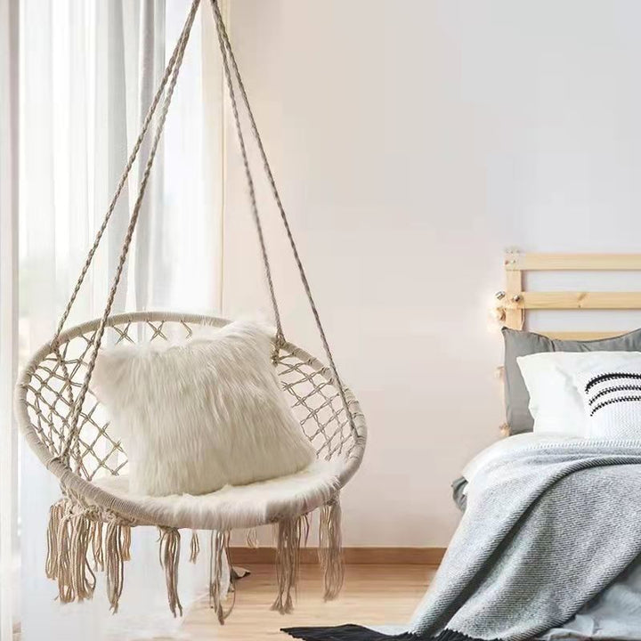 Boho macrame hanging swing chair with faux fur cushion and fringe Bowlift