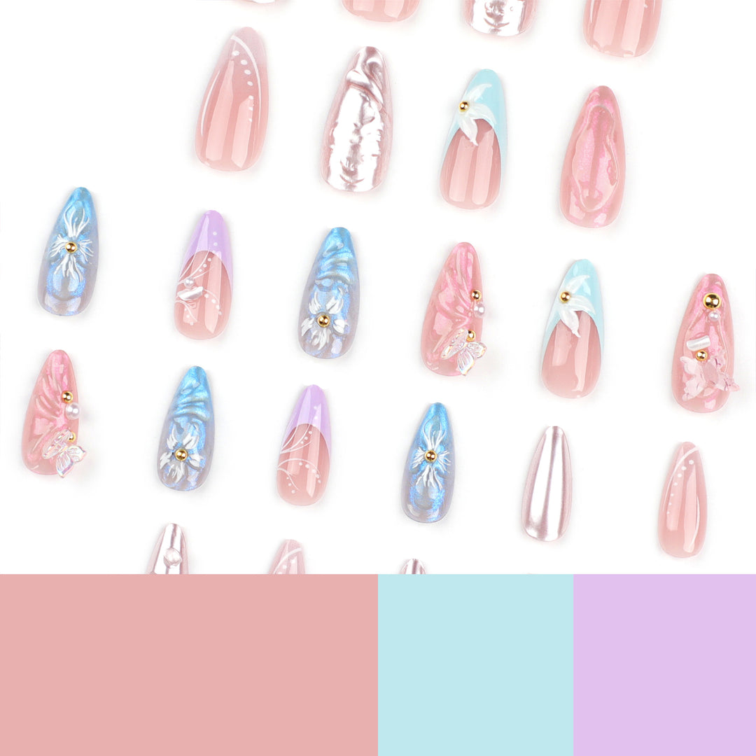 Artistic stiletto nails with delicate flower and glitter embellishments Bowlift