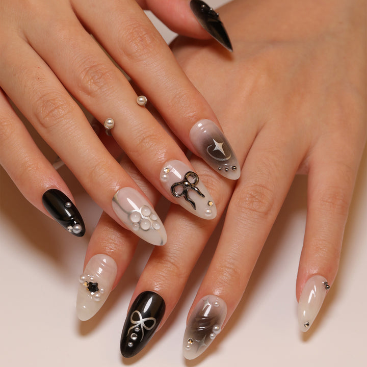 Elegant artificial nails with modern design and glitter accents Bowlift
