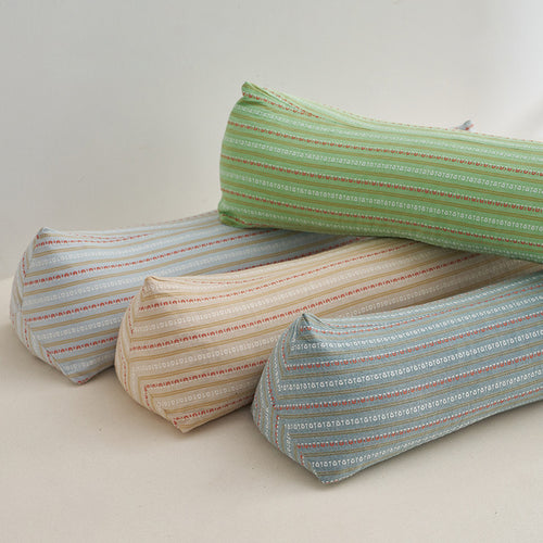 Ergonomic neck roll with stylish striped pattern Bowlift