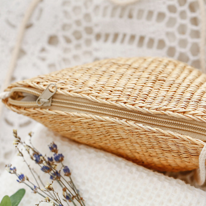 Handcrafted straw clutch with elegant design Bowlift