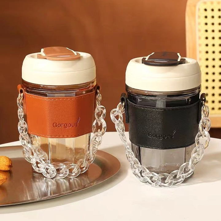 Women drinking cup with elegant leather handle and practical carrying chain Bowlift