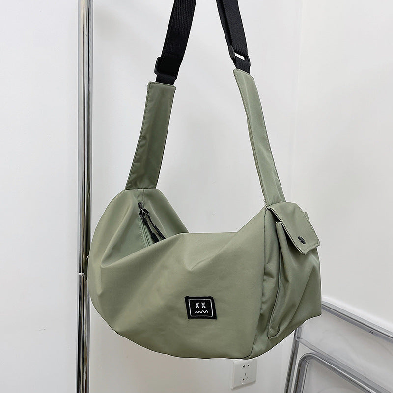 Sporty shoulder bag with adjustable carrying strap Bowlift