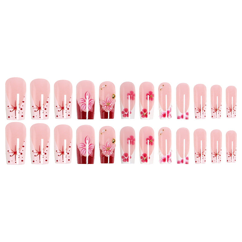 Artificial nail set with floral detail and glitter effects Bowlift