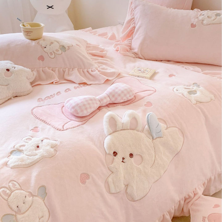 playful bedding set with frills and plush applications