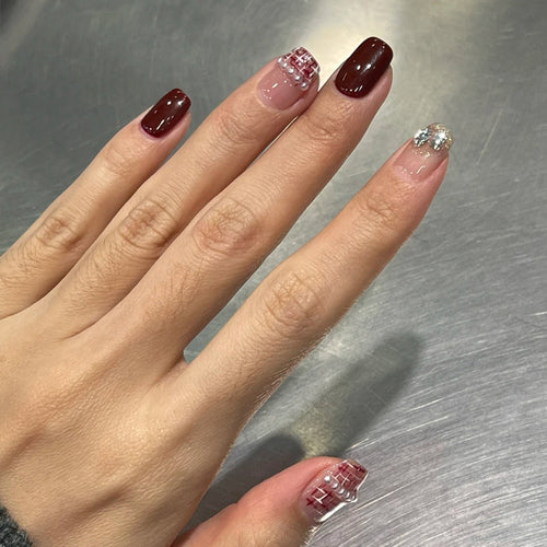 Elegant Press-On Nail Design with Glitter and Gemstone Accents Bowlift
