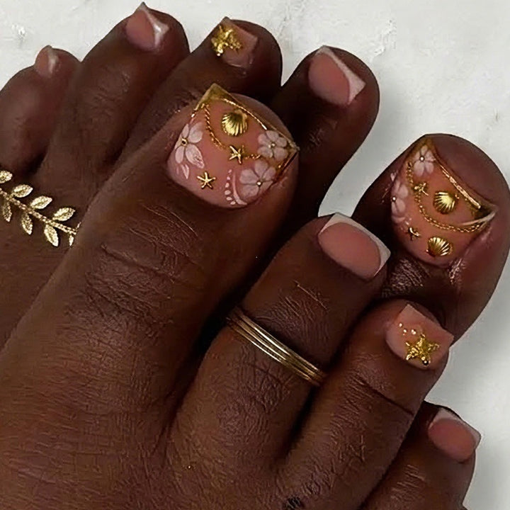 Artificial nail set with elegant, floral accents and golden decorations Bowlift