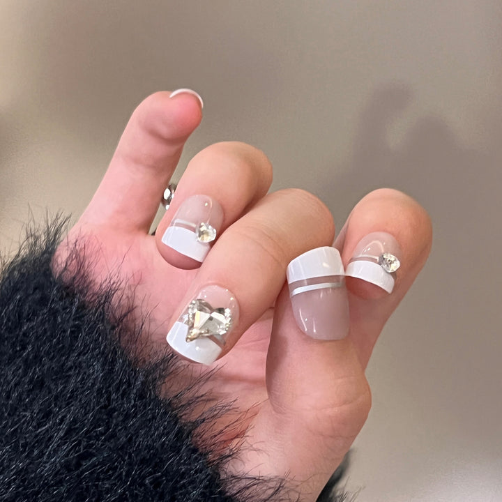 Elegant Nail Art with Glitter Accents and Jewelry Details Bowlift