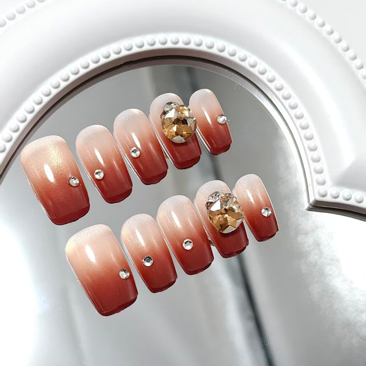 Artificial nail set with glittering rhinestone applications Bowlift