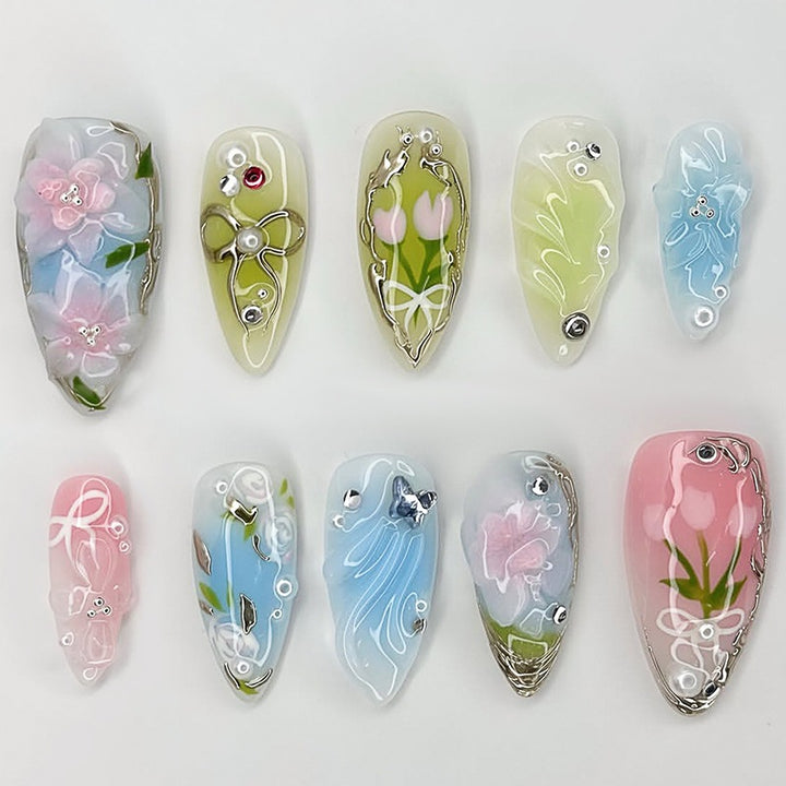 Creative nail set with hand-drawn floral patterns and glitter accents Bowlift