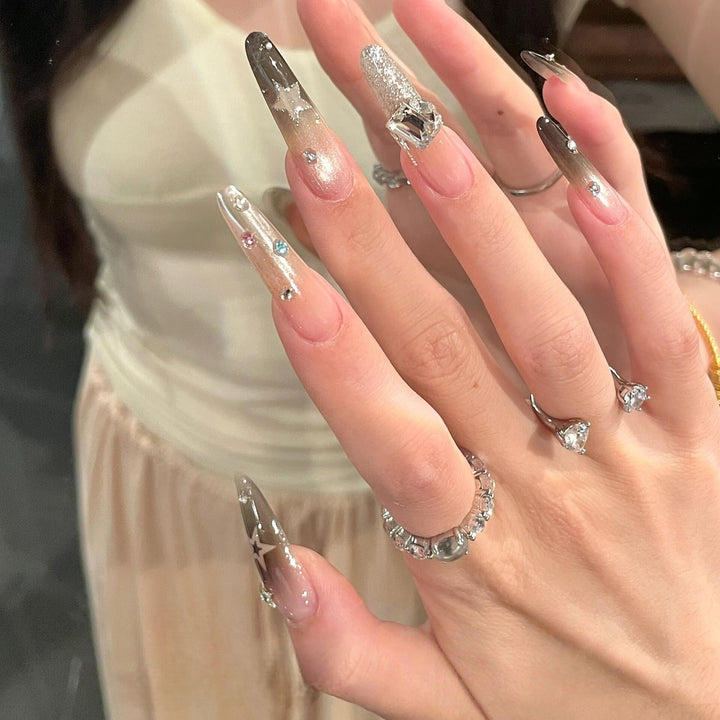 Glamorous artificial nails with sparkling rhinestone and star designs Bowlift