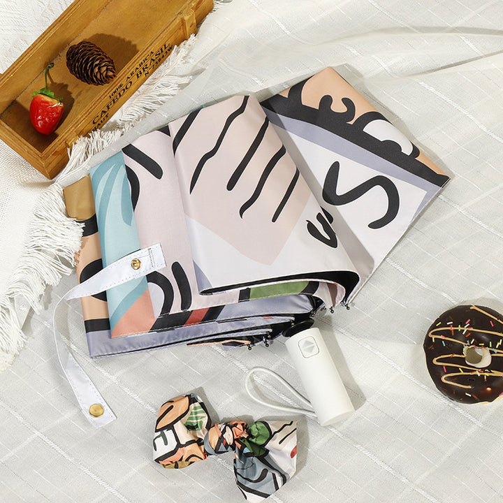 Women's folding umbrella with colorful animal design and durable frame Bowlift