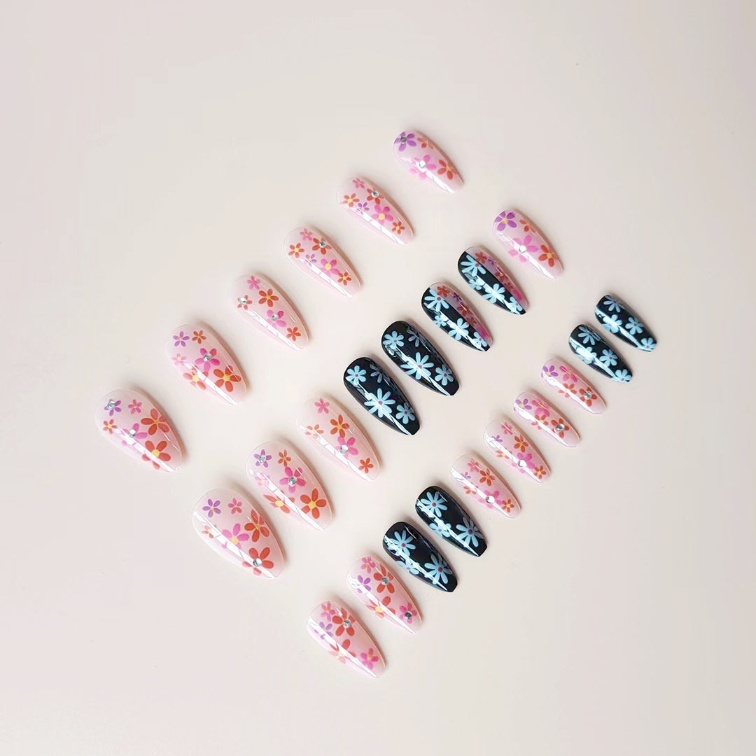 Artificial nail set with floral 3D embellishments and glitter accents Bowlift