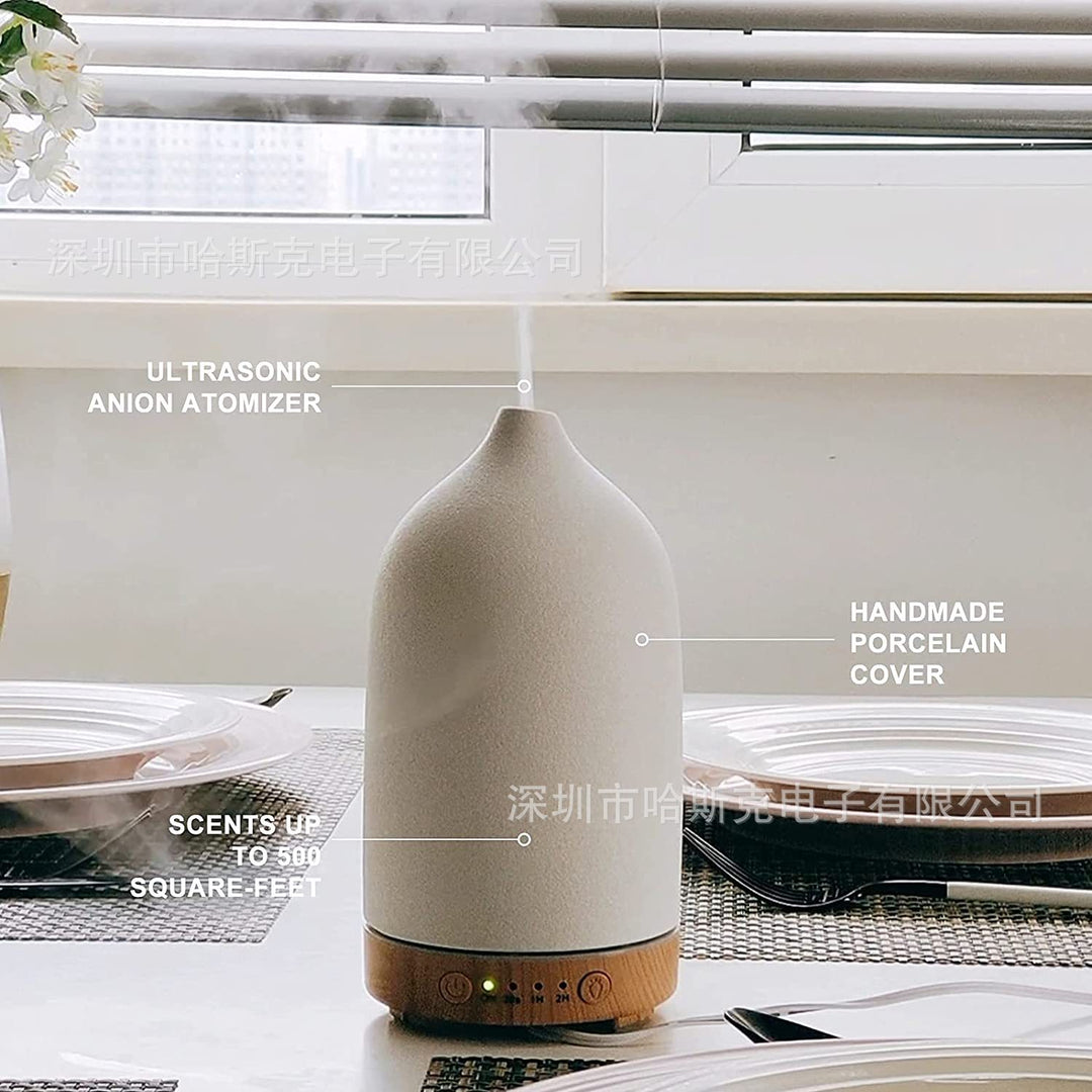 Ultrasonic essential oil diffuser with wood grain base and matte textured ceramic cover Bowlift