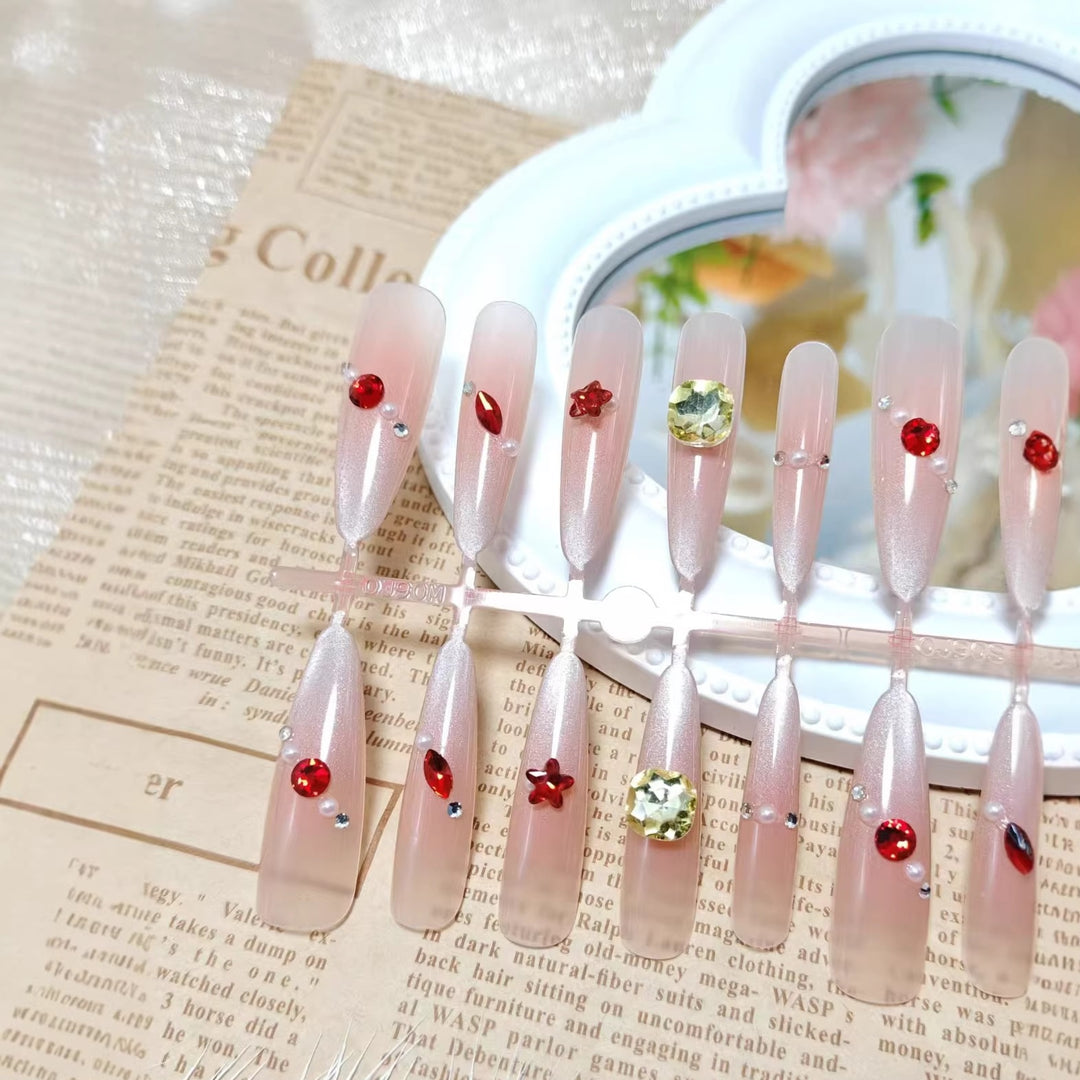 Glamorous artificial nails with shimmering embellishments Bowlift
