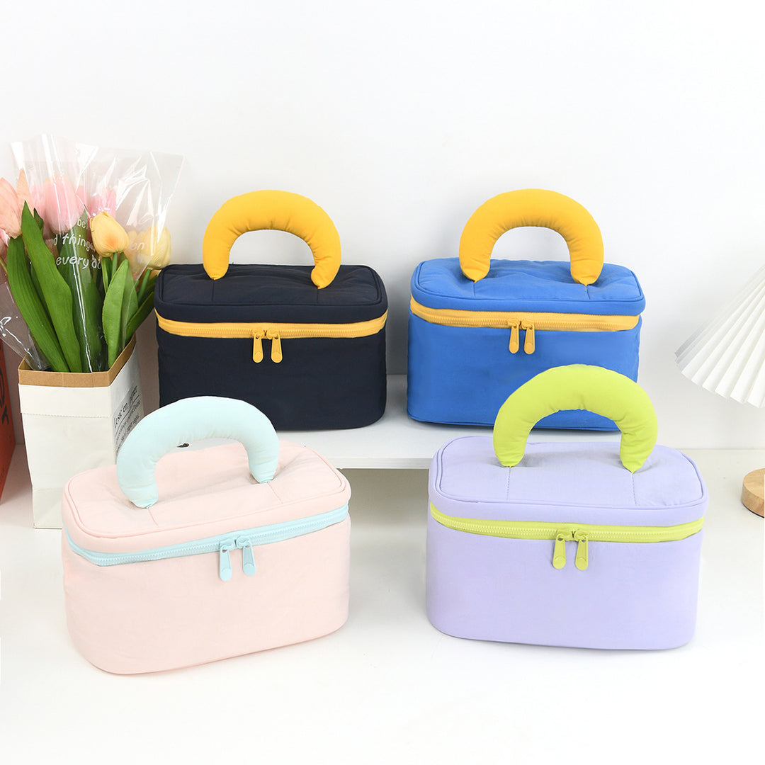 Cosmetic organizer with ergonomic carrying handle Bowlift