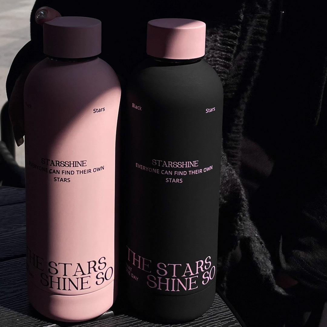 Women's insulated bottle with ergonomic design and practical carrying strap Bowlift