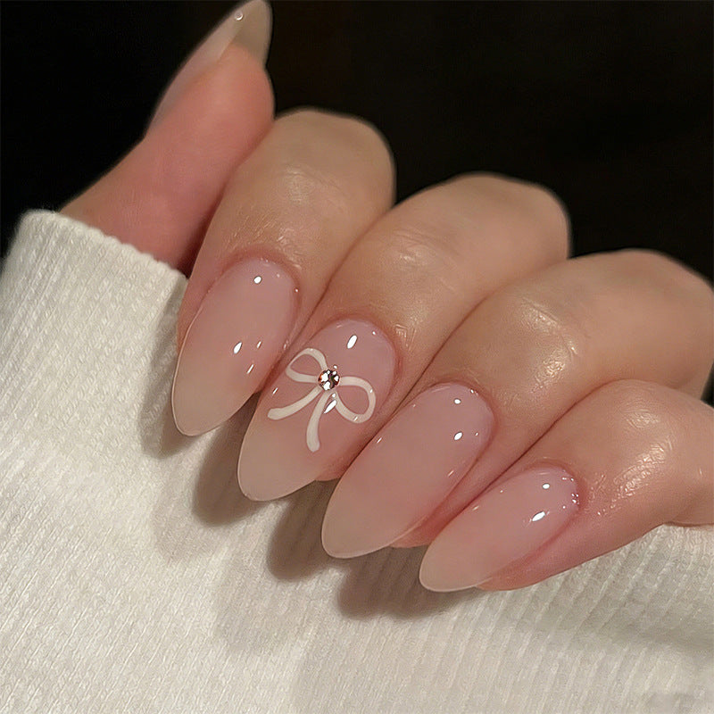 Acrylic nail set with elegant bow accents Bowlift
